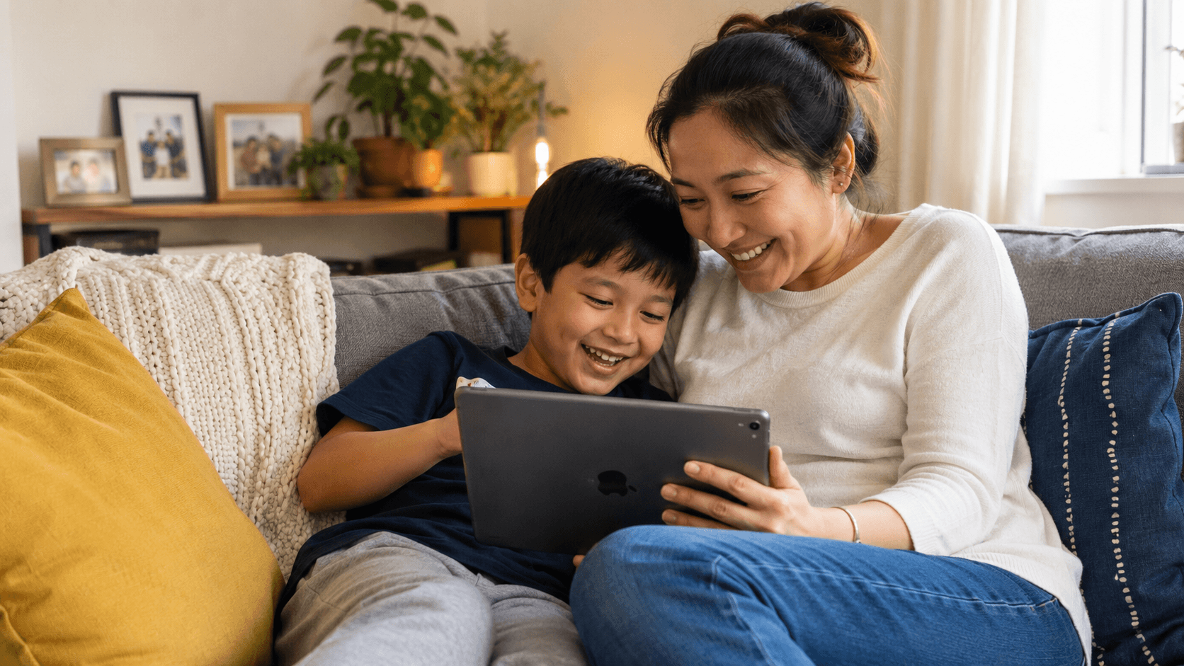 Parent and child reading a children's story together on a tablet